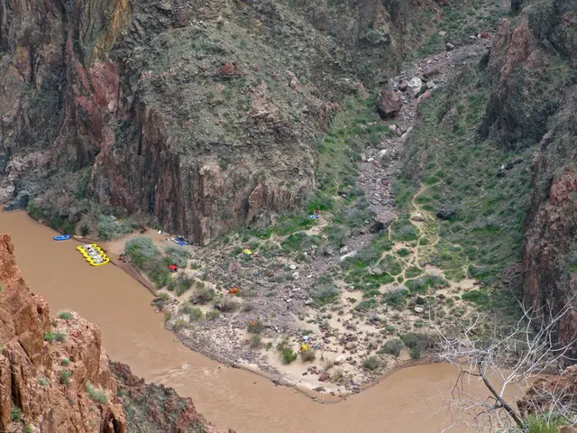 This picture is the aerial view of the river. At the bottom, we see the water flowing in the river....