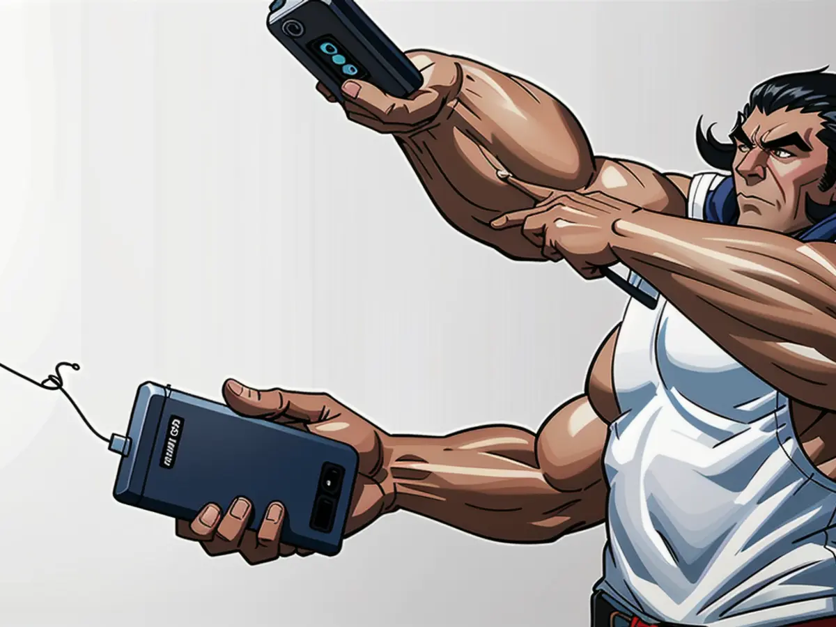 User with smartphone plugged into Anker power bank, charging on the go User with smartphone plugged into portable Anker power bank, charging device on the go